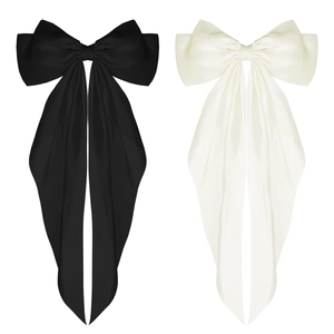 Elegant large satin bow hair clips in black and cream white with long ribbons for women