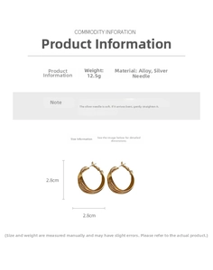 Detail view of twisted gold hoop earrings showing 2.8cm diameter and 12.5g weight info