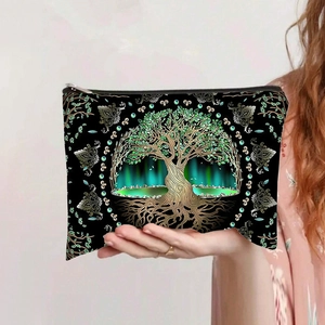 Detail of canvas pouch featuring a golden Tree of Life print and metal zipper closure