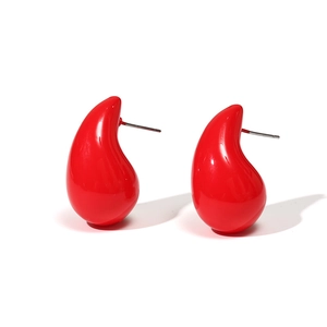 Minimalist red teardrop stud earrings with a glossy high-shine finish on white background