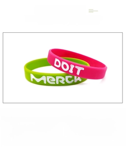 Detailed view of flexible silicone wristband with debossed color-filled lettering