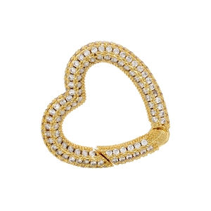 Macro view of gold-plated heart-shaped jewelry clasp with pave white zircon inlay