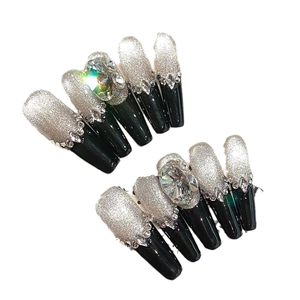 Luxury black and silver glitter press-on nails with sparkling rhinestones and oval gems