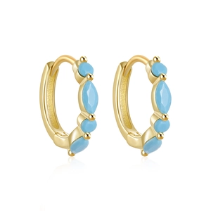 Detail of gold-plated silver earrings with pavé marquise blue stones and round crystals