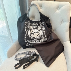 Nylon tote bag details showing inner organizer bag and decorative woven rope shoulder strap