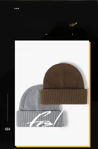 Detailed close-up of thick ribbed texture on brown and grey winter knit beanies