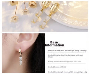 Detail view of bamboo-shaped hoop earrings with cat-eye stone and cubic zirconia inlay