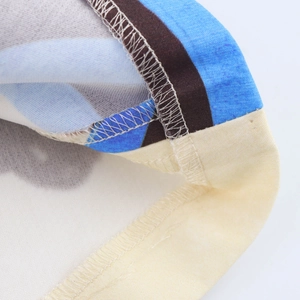 Detailed close-up of the professional stitching and hem on the floral print maxi skirt
