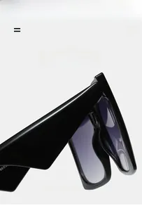 Detail view of black square sunglasses with gradient lenses and high gloss material