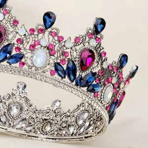Detailed view of Baroque bridal crown with multi-colored crystals and silver setting