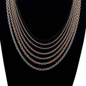 Layered vintage fringe necklaces in gold, silver, and black polished titanium steel