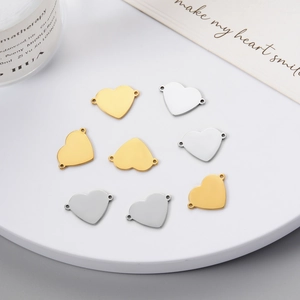 Polished heart shaped double-hole stainless steel jewelry connectors in gold and silver