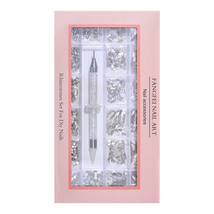 21-grid nail art rhinestone set with assorted silver glass gems and dual-ended dotting tool