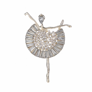 Elegant ballerina brooch with sparkling crystals and metal finish on a white background