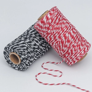 Red-white and black-white baker's twine on kraft tubes for Christmas DIY gifts