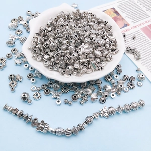Vintage silver spacers in butterfly and turtle shapes for DIY jewelry making