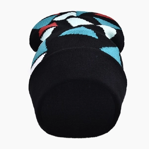 Close-up of black knit beanie featuring geometric triangle patterns in red and blue