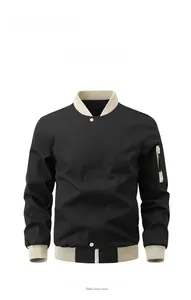 Close-up of black varsity jacket featuring beige ribbed cuffs and sleeve zipper pocket