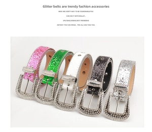 Detail of colorful sequin belts with luxury rhinestone buckles in pink, green, and silver