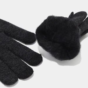 Detailed view of black knitted gloves with thick fleece lining for winter warmth