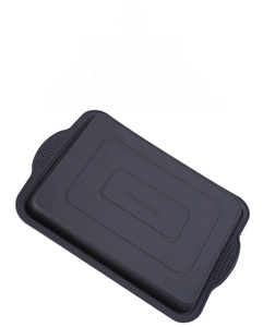 Detail of grey silicone brownie pan with non-slip handles and heat resistance icons