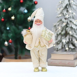 Close-up of elegant champagne gold Santa figurine holding gifts with festive background