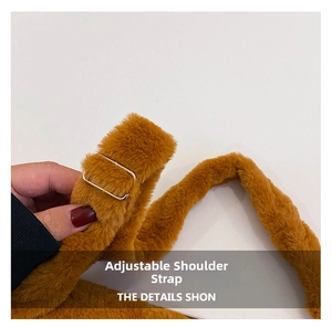 Close-up of plush caramel bag strap with adjustable gold metal buckle accessory