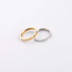 Close-up of interlocking gold and silver 3mm mirror polished stainless steel rings