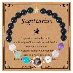 Detail of Sagittarius zodiac bracelet with blue sandstone and colorful beads on card