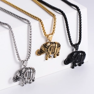 Detailed view of punk elephant pendants in gold, silver and black finishes