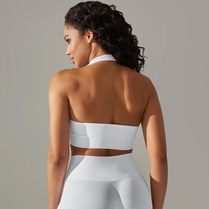 Close-up of white ribbed seamless knitted back detail on a halter neck sports bra