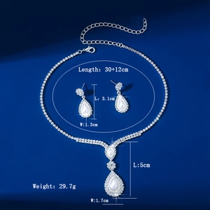 Detail view of pearl and rhinestone jewelry set with precise size and weight measurements