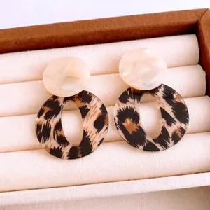 Retro acrylic leopard print drop earrings with cream marble resin studs in a jewelry box