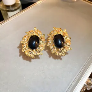 Vintage gold oval leaf earrings with black gemstone in French palace style for women
