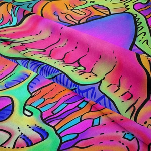 Close-up of vibrant psychedelic tapestry fabric showing abstract colorful wave patterns
