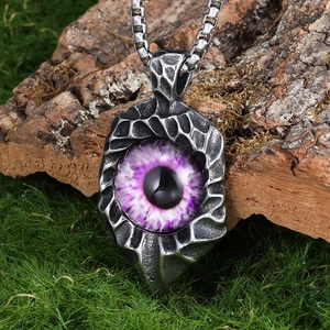 Gothic stainless steel evil eye pendant necklace with purple pupil on natural tree bark