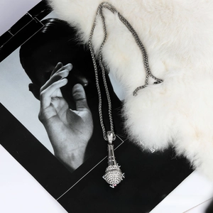 Close-up of hip hop silver microphone pendant with micro-pave white rhinestones