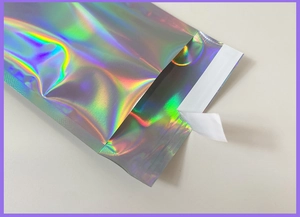 Detail of holographic self-sealing bubble mailer with a shimmering laser finish for shipping