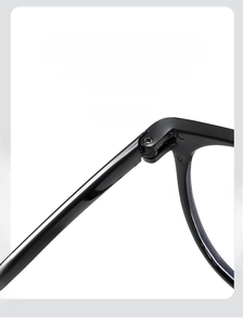 Close-up of a sturdy black eyeglass hinge with smooth metal screw for durability