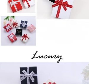 Multi-color jewelry gift boxes with satin ribbons and clover necklace display