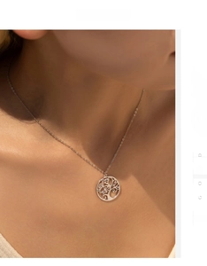 Elegant Tree of Life pendant necklace with colorful zircons worn on model's neck
