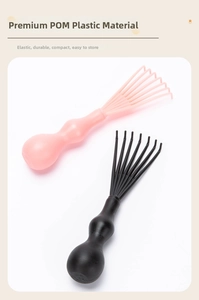 Close-up of pink and black scalp massagers made of durable POM material with round handles