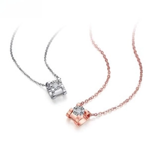 Detailed view of square pendant necklaces in polished silver and rose gold finishes