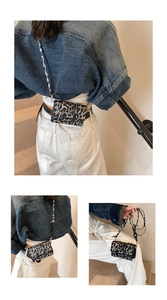 Mini leopard print crossbody bag styled as a waist pouch on a denim jacket model
