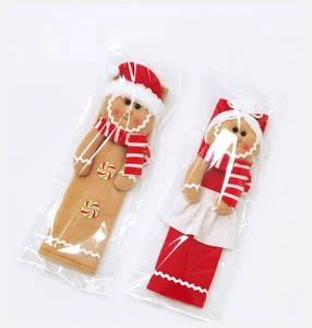Detailed view of gingerbread man handle covers in transparent protective packaging