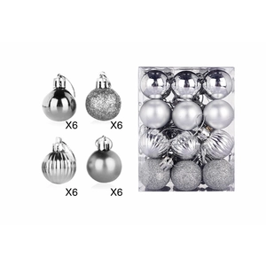 Detail of silver Christmas ball set featuring mirror, glitter, striped and matte finishes