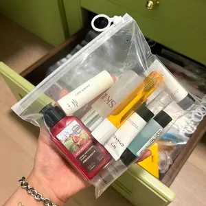 Minimalist transparent PVC travel storage pouch with white slider for cosmetics and toiletries