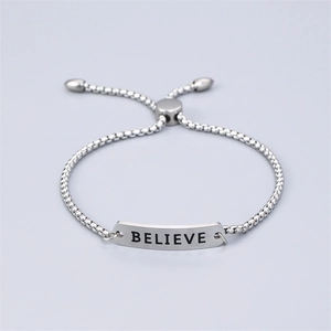 Silver stainless steel bracelet with engraved BELIEVE plate and adjustable cord