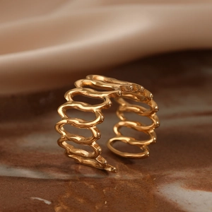 Minimalist wave-shaped golden open ring with hollow cage design in stainless steel