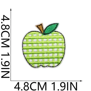 Detail showing embroidered green checkered apple patch with dimensions 4.8cm x 4.8cm